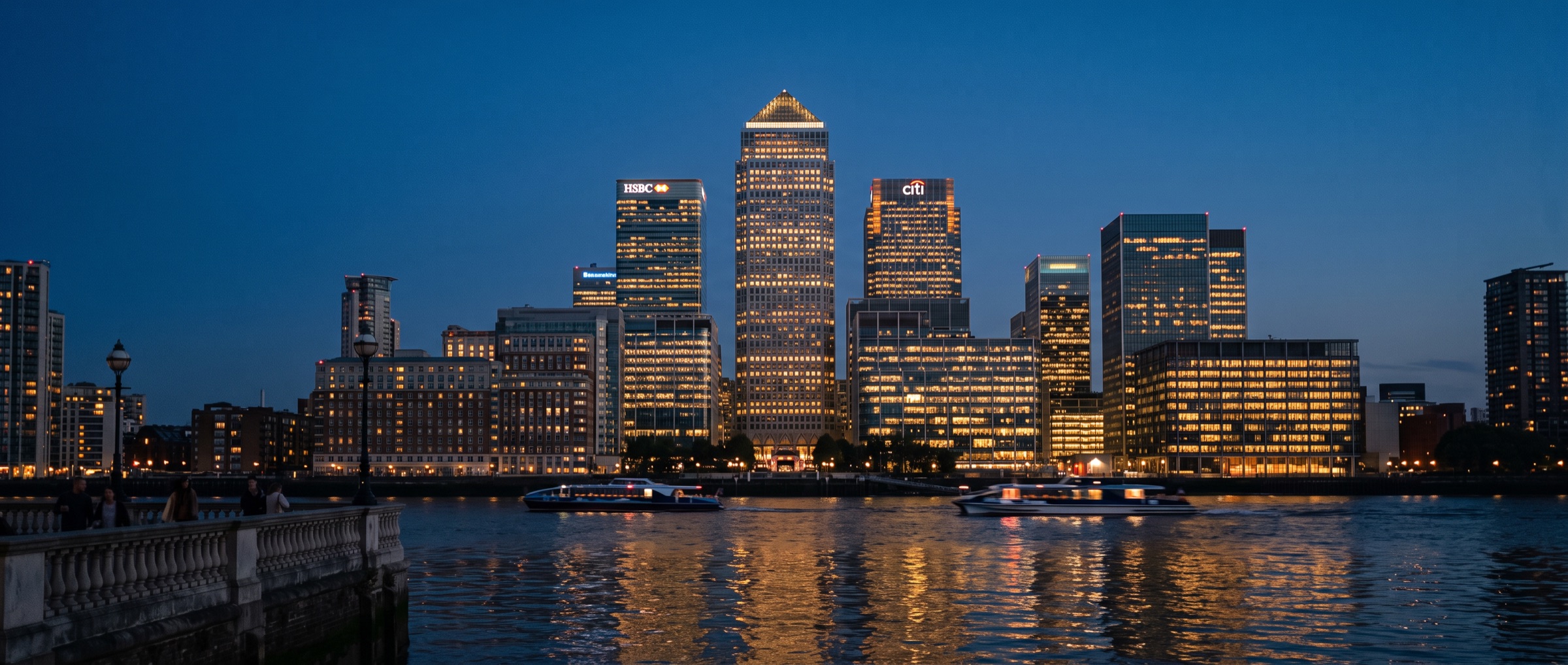Canary Wharf skyline across the Thames at dusk